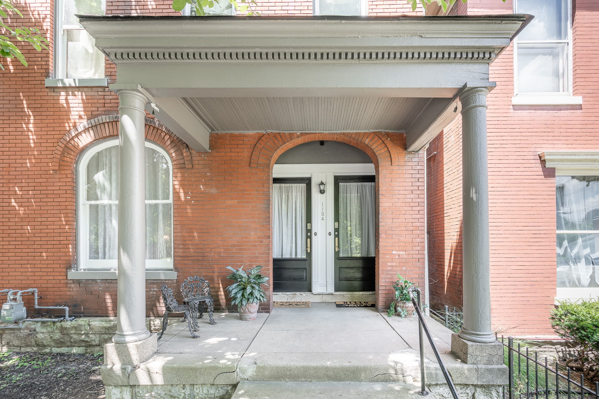 Living room in a restored Old Louisville Victorian apartment
